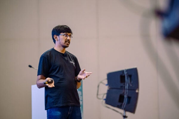 Attendees, speakers and open source community sessions at Open Source Summit India 2026 - Day 1 at Jio World Convention Centre, Mumbai, photographed by Tell-a-Tale Studios.